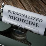 a typewriter with a paper that reads personalized medicine